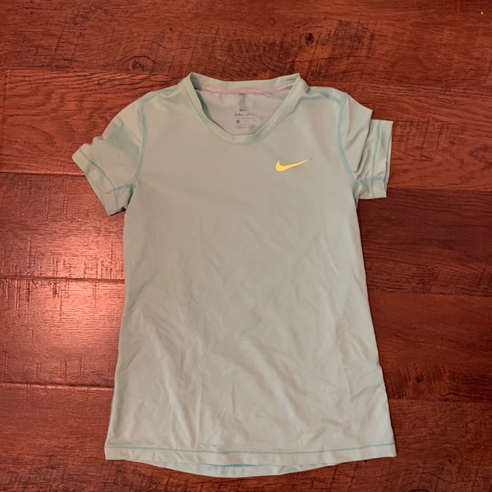 Iight blue with neon Nike sign dri-fit shirt
